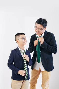 Happy Vietnamese Father And Son Tying Neckties When Getting Ready For School And Work In The Morning