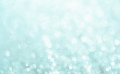 Green background. White glitter blur vintage lights background. Bokeh silver and white. de-focused copy space.