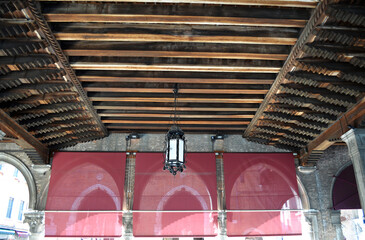
Venice fish market pavilion with historic lantern suspended from the wooden beam ceiling