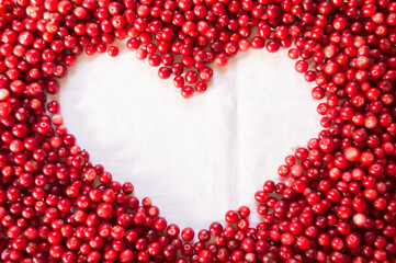 Red lingonberry. View from above . heart shaped copy space