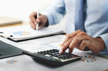 businessman working with using calculator in office. finance and accounting concept