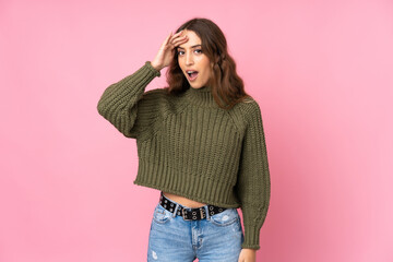 Young woman over isolated pink background has just realized something and has intending the solution