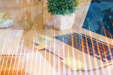 Multi exposure of graph and financial info and work space with computer background. Concept of international online trading.