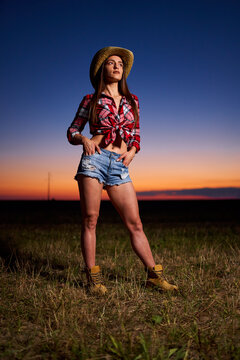 Young cowgirl at sunset