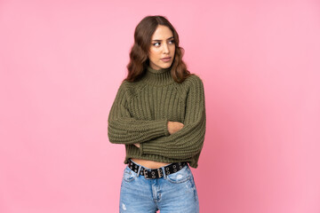 Young woman over isolated pink background portrait