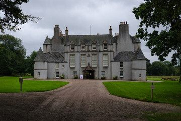 View of Leith Hall Castle among the trees on a cloudy day, Scotland, United Kingdom