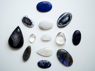 Multicolored semi-precious stones on a white background