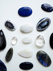 Multicolored semi-precious stones on a white background