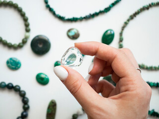 Natural white quartz pendant in a woman's hand