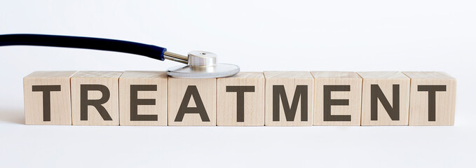TREATMENT medicine word written on wood block