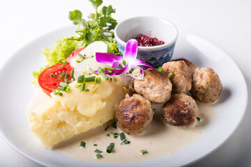 Plate of Swedish meat balls with mash potato and sauce