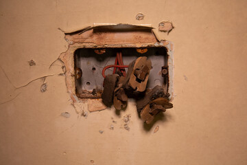 Vintage rusty broken double light switch panel from my urbex exploration.
