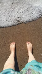 feet on the beach