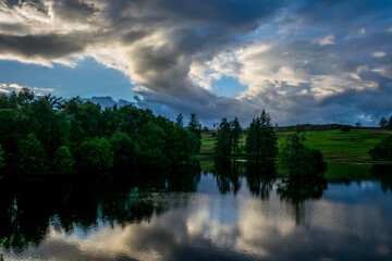 Lake in the forest with beautiful sky reflection