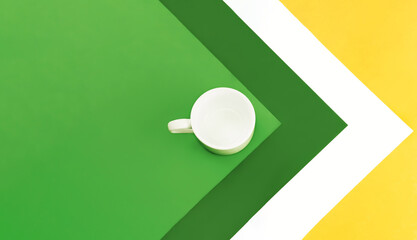 On a multicolor background, a white empty cup for coffee or tea. Design. Christmas concept. New Year concept. Christmas mock up. Space for text.