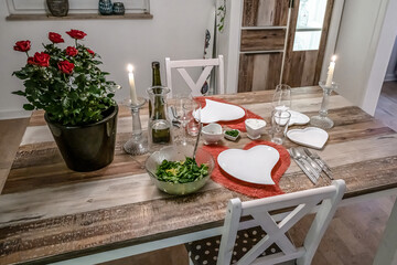 Valentines day dinner setting romantic love for two wooden table red heart shape candle light with roses