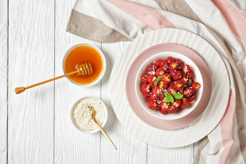 Raspberry filled with shredded coconut and orange