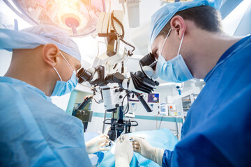 A team of surgeons performing brain surgery to remove a tumor.