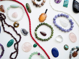 Multicolored semi-precious stones on a white background