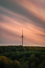 Stuttgart Television Tower (Fernsehturm) against sunset sky wit fast moving clouds, Germany © Timo Günthner