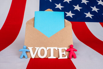 Fototapeta na wymiar Election of the President of the United States. A ballot in an envelope against the background of the USA flag. The word vote next to the colored people. American elections 2020.