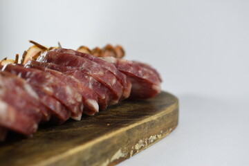 photos of a table of cold cuts in the foreground
