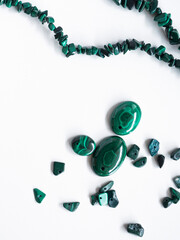 Natural malachite of different sizes on a white background