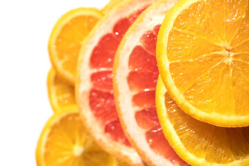 Orange and grapefruit rings are shot close-up with selective focus as background