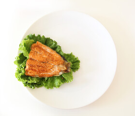 fish fillet on salad