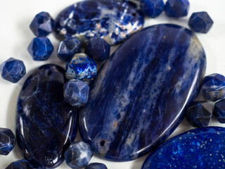 Natural sadolite of different sizes on a white background