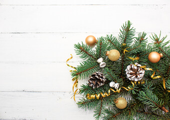 Christmas and New Year composition with golden glitter ball and strip on a white wooden background