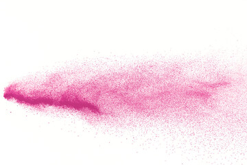 Freeze motion of pink color powder exploding on white  background. 