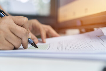 Fototapeta premium Businessman executive signing on official document paperwork files contract on office table for approval management of responsible, signature meeting for startup concept