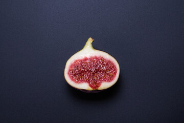 Tasty figs on a black background. Top view.