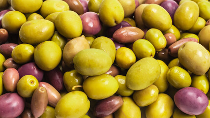 Tasty mix olives background.