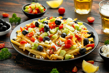 Loaded potato Vegan Fries with tomato, cucumber, olives and feta cheese