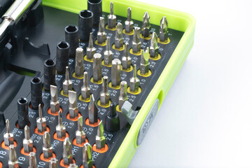 Sets of screwdriver metal bits isolated on white background. Tool set for household use. Nozzles and adapters for screwdrivers. Head different size hex driver.