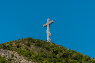 High 43-meter Orthodox cross on the Markhotsky ridge with a view of The Gelendzhik Bay.