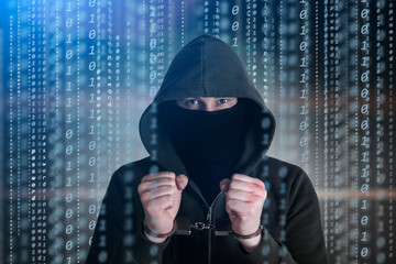 Computer privacy attack. Hackers programmer look on screen and forcibly writes the program code...