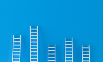 Ladder white random collection with one overhanging on blue wall studio background. leadership, success concept. 3d rendering.