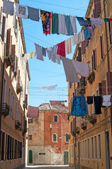 Fototapeta na wymiar typical clothesline in the historic street in Venice Italy