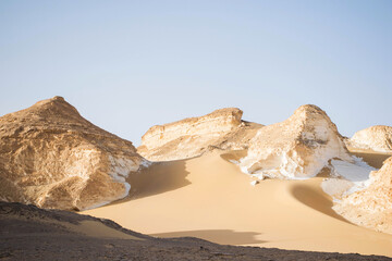 Fototapeta na wymiar Desert landscape with sanddunes and rock formations. Bahariya nature reserve egypt. Extreme travel destinations. Sahara nature scene. Exploring wild nature 
