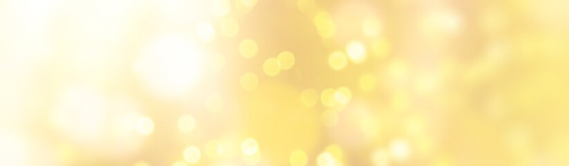 Abstract Christmas yellow background banner with golden bokeh lights