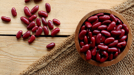 Red bean seeds in a wooden bowl