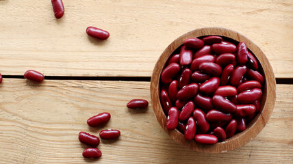 Red bean seeds in a wooden bowl