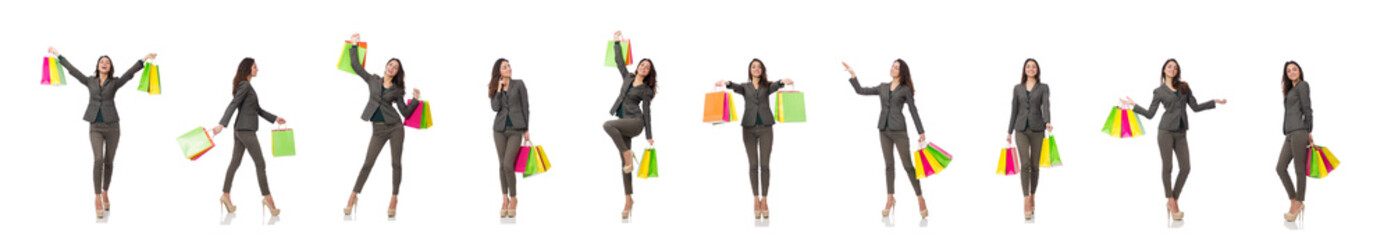 Attractive woman with shopping bags isolated on white