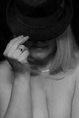 woman with hat with low neckline