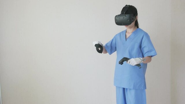 Futuristic Hospital Technology In Medical Education Concept. Doctor Or Nurse Try To Using Augmented Mixed Virtual Reality For Learning, Or Analysing In Medical Data In 3d With Artificial Intelligence
