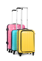 Stylish suitcases packed for travel on white background. Summer vacation