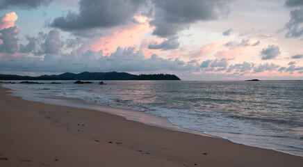 Beach background with sea wave and island,reflection of sunlight around smoky cloud,beautiful by nature